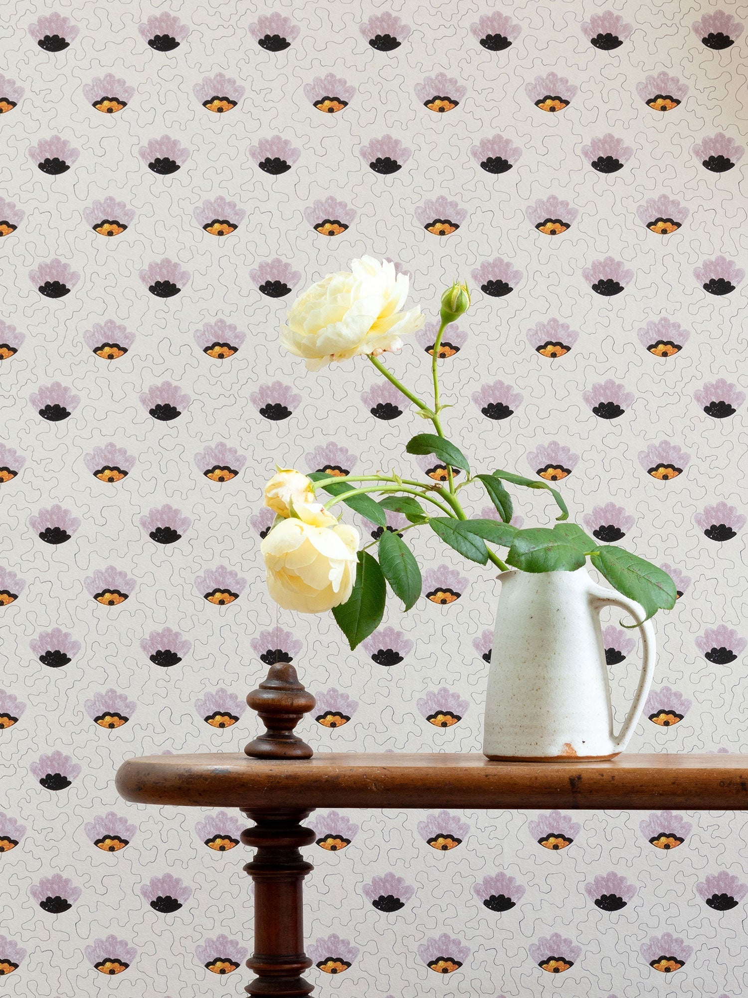 Pink pop art wallpaper with anthropomorphic eyes, pictured with roses