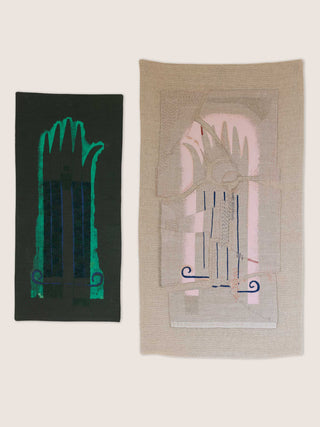 Embroidered wallhangings made from cushion cover seconds depicting a broken hand sewed back together