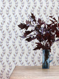 An archival design dating back to 1800, this wavy wallpaper displays falling oak leaves in pink and blue, pictured with oak leaves in a vase