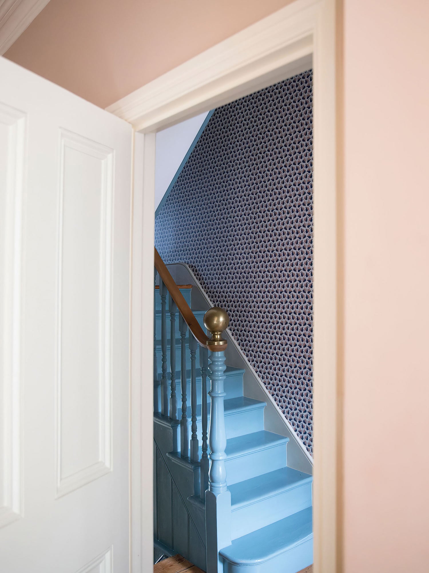 A love letter to repetition in nature, this pink and blue leaf design by William Kilburn dates from 1800, pictured here by blue painted staircase in Victorian house