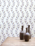 An archival design dating back to 1800, this wavy wallpaper displays falling oak leaves in pink and blue, pictured with three brown vases